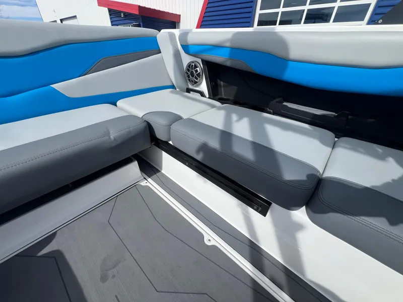 Slide: The Image of 2023 Axis Wake Research T220 boat interior with blue and gray seating. - 13