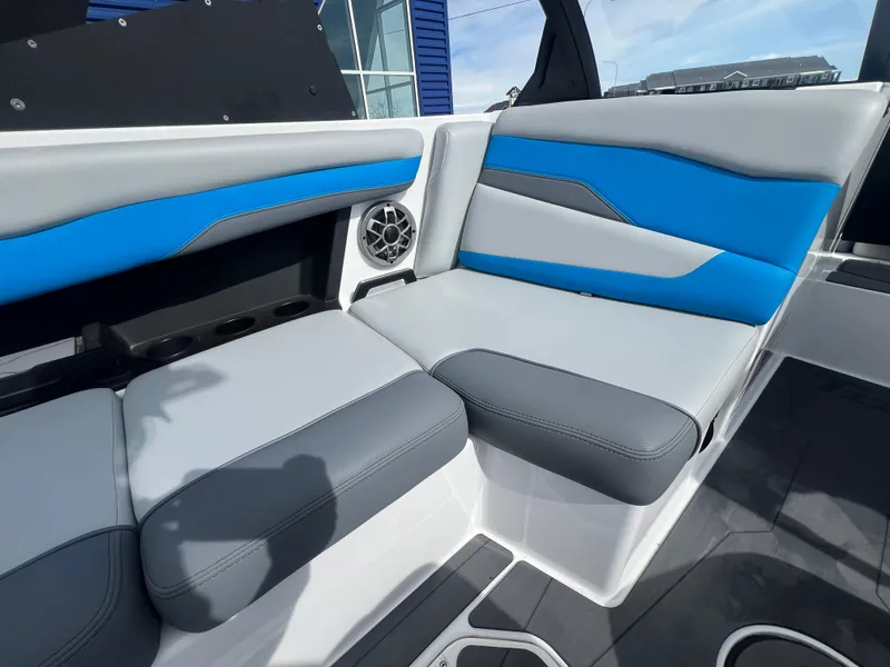 Slide: The Image of 2023 Axis Wake Research T220 boat interior with blue and gray seating. - 14