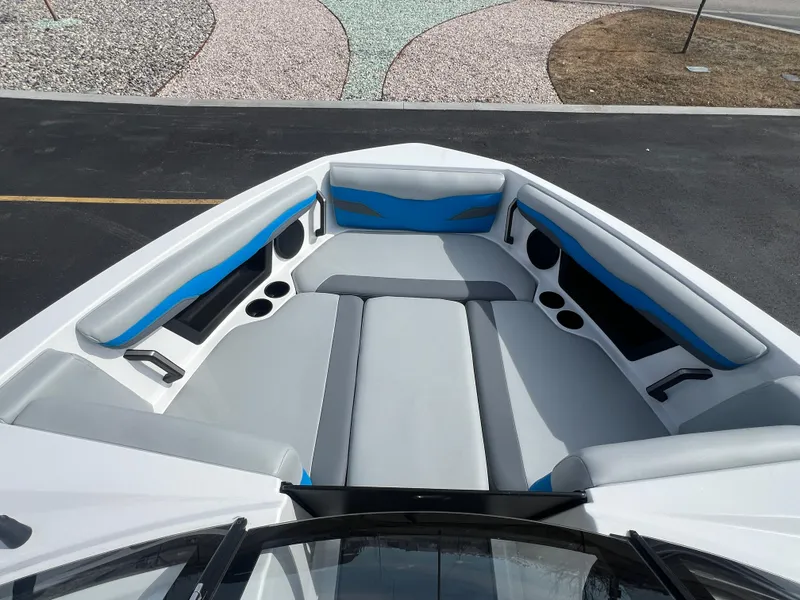 Slide: The Image of 2023 Axis Wake Research T220 boat interior with gray and blue seating. - 16