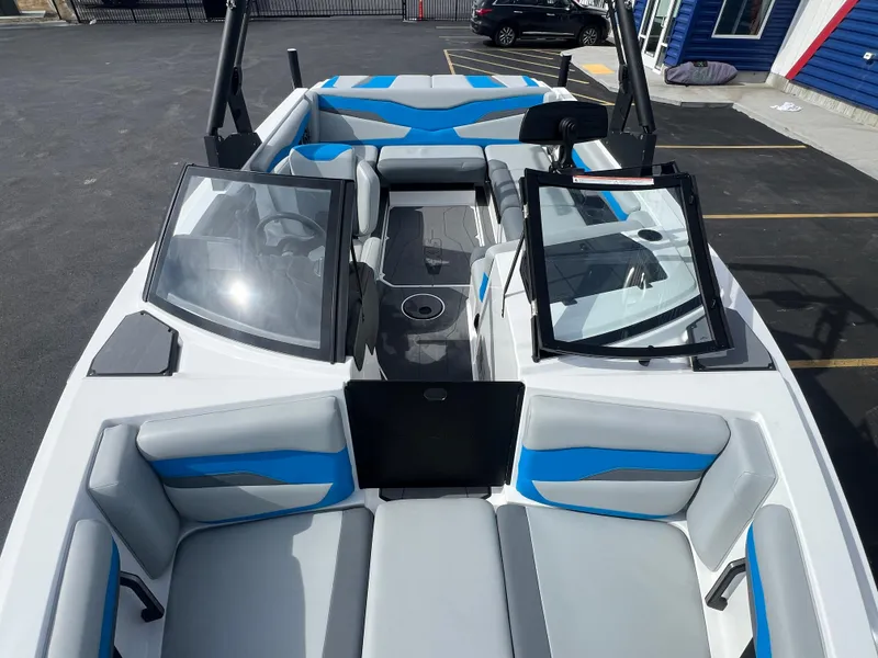 Slide: The Image of 2023 Axis Wake Research T220 boat interior with blue and gray seating. - 17