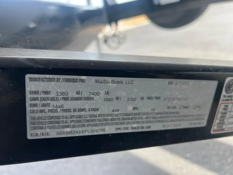 Slide: The Image of Label on 2023 Axis Wake Research T220 trailer by Malibu Boats, showing specifications and compliance details. - 20