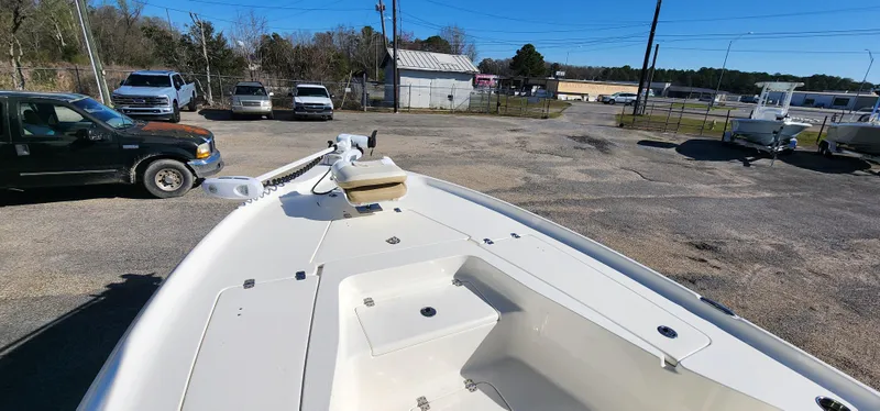 Slide: The Image of 2019 Key West 230BR boat in parking lot, featuring spacious deck and modern design. - 13
