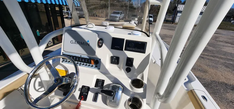 Slide: The Image of 2019 Key West 230BR boat dashboard with Garmin navigation system and steering wheel. - 14