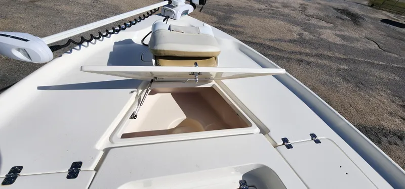 Slide: The Image of 2019 Key West 230BR boat deck with open storage compartment and seating. - 16
