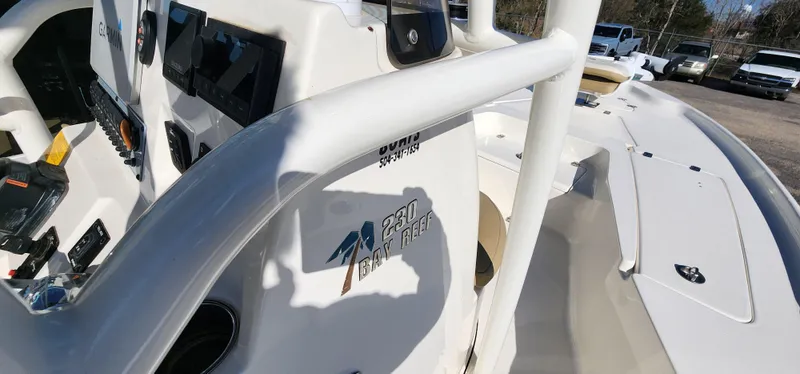 Slide: The Image of 2019 Key West 230BR boat interior with control panel and branding. - 19
