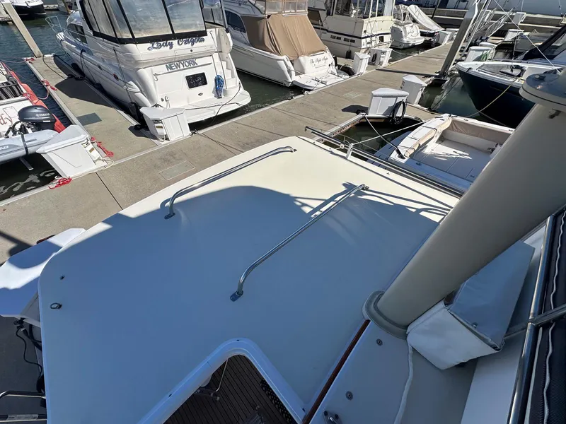 Slide: The Image of 2000 Legacy Yachts 40 Sedan docked at marina, top deck view. - 25