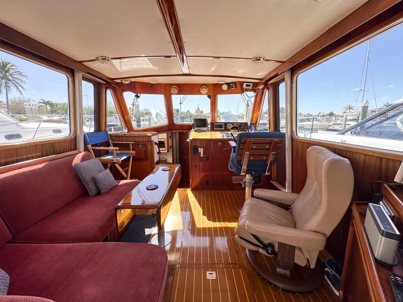 Slide: The Image of Interior of 2000 Legacy Yachts 40 Sedan with plush seating and wooden finishes. - 26