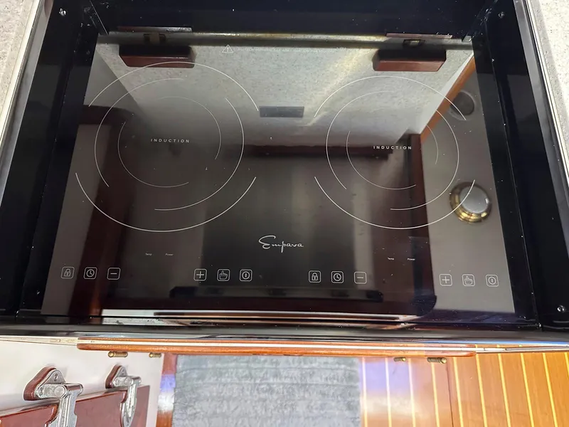 Slide: The Image of Induction cooktop on 2000 Legacy Yachts 40 Sedan, featuring dual burners and touch controls. - 30