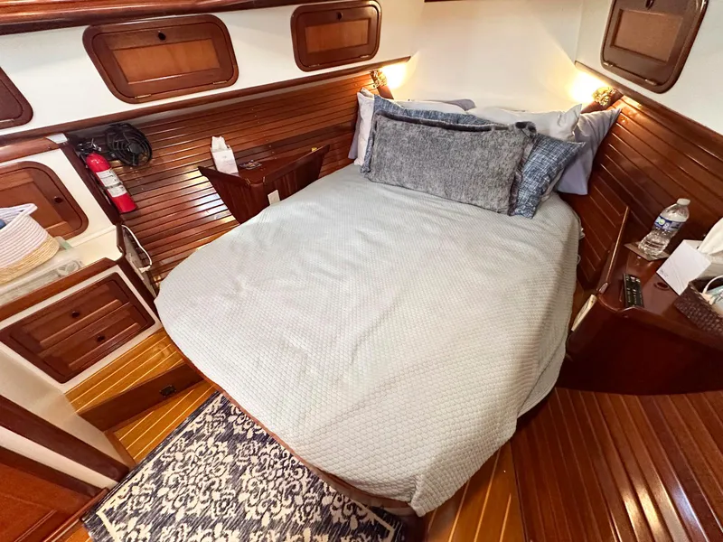 Slide: The Image of Luxurious cabin interior of 2000 Legacy Yachts 40 Sedan with cozy bed and elegant wood finish. - 35