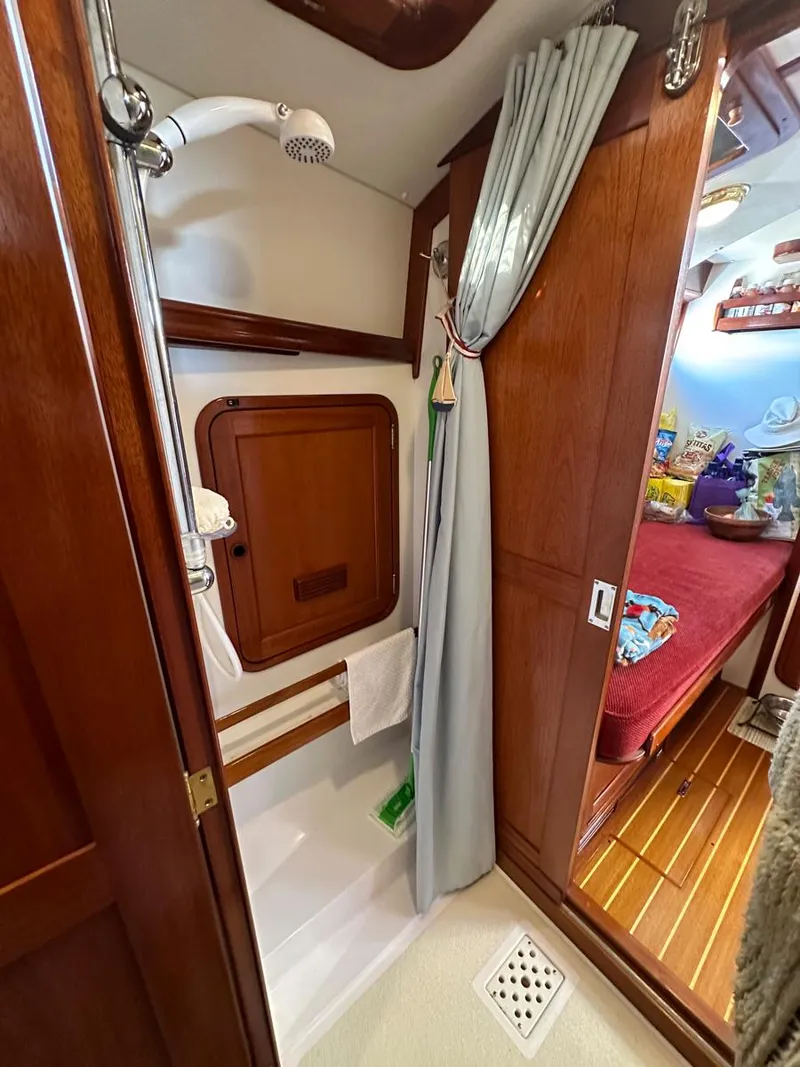 Slide: The Image of Galley of 2000 Legacy 40 Sedan with microwave and porthole window. - 42