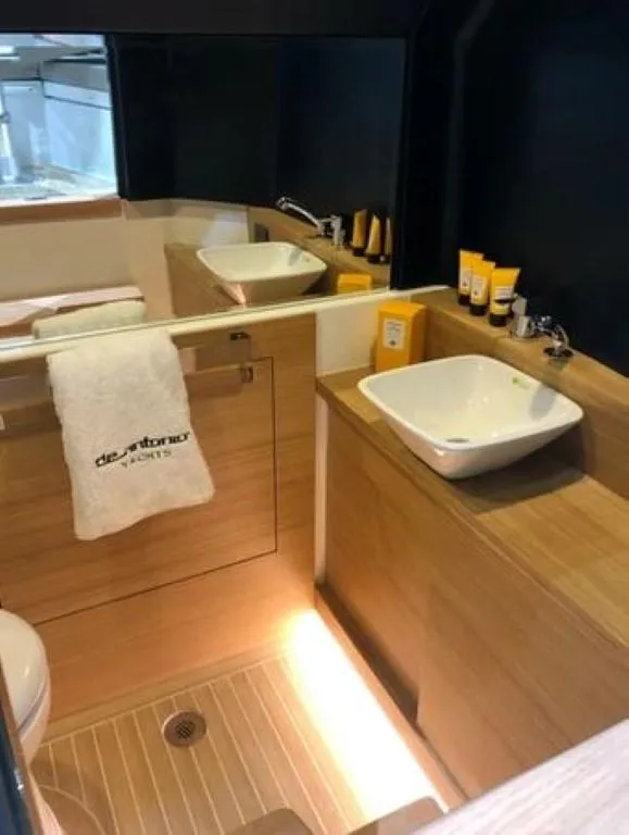 Slide: The Image of 2024 De Antonio Yachts D28 Open bathroom with modern fixtures and wooden accents. - 9