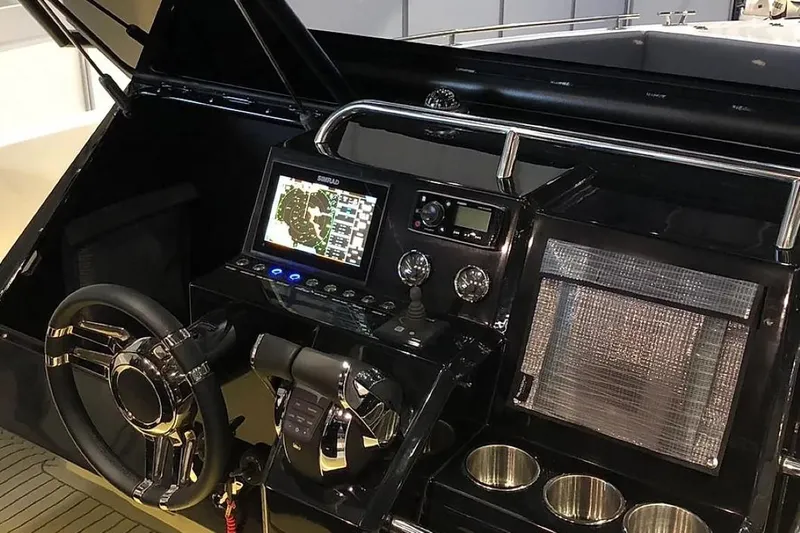 Slide: The Image of 2024 De Antonio Yachts D28 Xplorer cockpit with advanced navigation system and controls. - 12