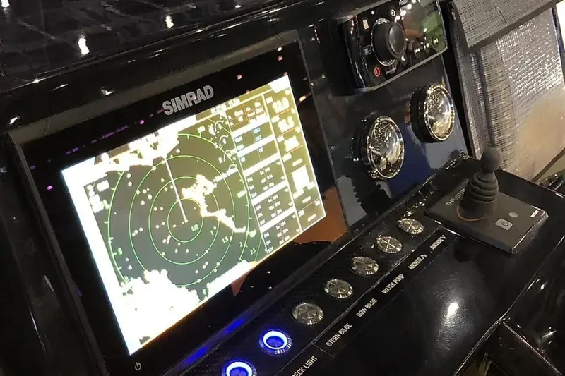 Slide: The Image of 2024 De Antonio Yachts D28 Xplorer dashboard with Simrad navigation system and control panel. - 13