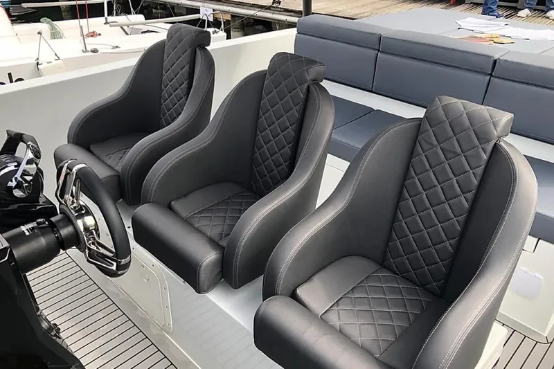 Slide: The Image of 2024 De Antonio Yachts D28 Xplorer with luxurious quilted seats and modern steering wheel. - 14