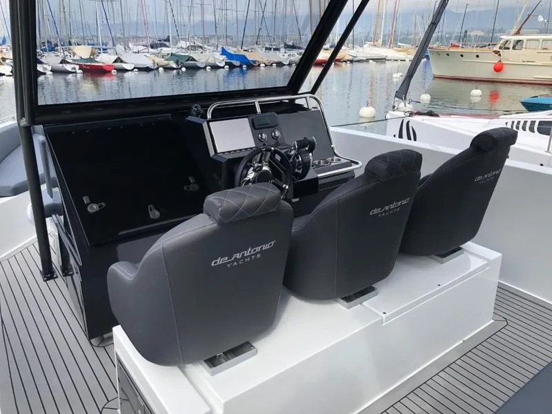 Slide: The Image of 2024 De Antonio Yachts D28 Xplorer cockpit with sleek seating and modern controls. - 17