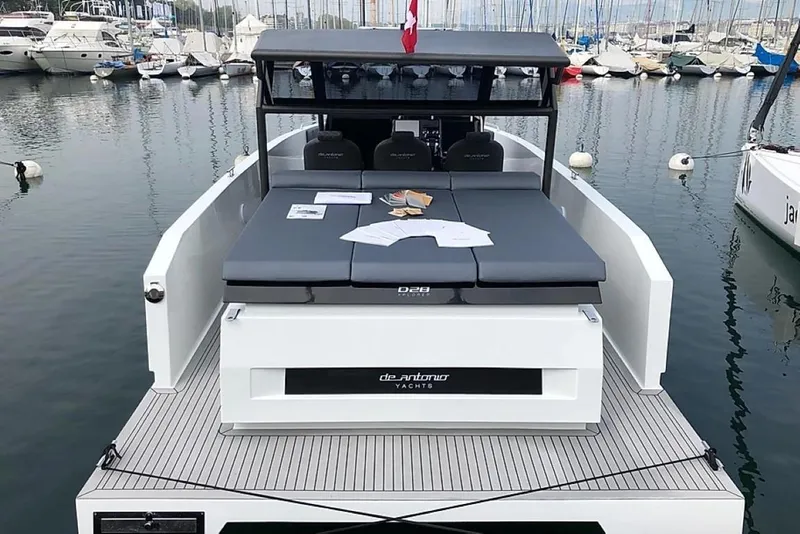 Slide: The Image of 2024 De Antonio Yachts D28 Xplorer docked, showcasing sleek design and spacious deck. - 4
