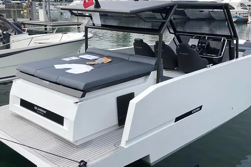 Slide: The Image of 2024 De Antonio Yachts D28 Xplorer, sleek design, docked at marina. - 6