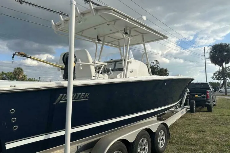 Slide: The Image of 2008 Jupiter 31 FS Center Console boat on trailer, parked outdoors. - 14