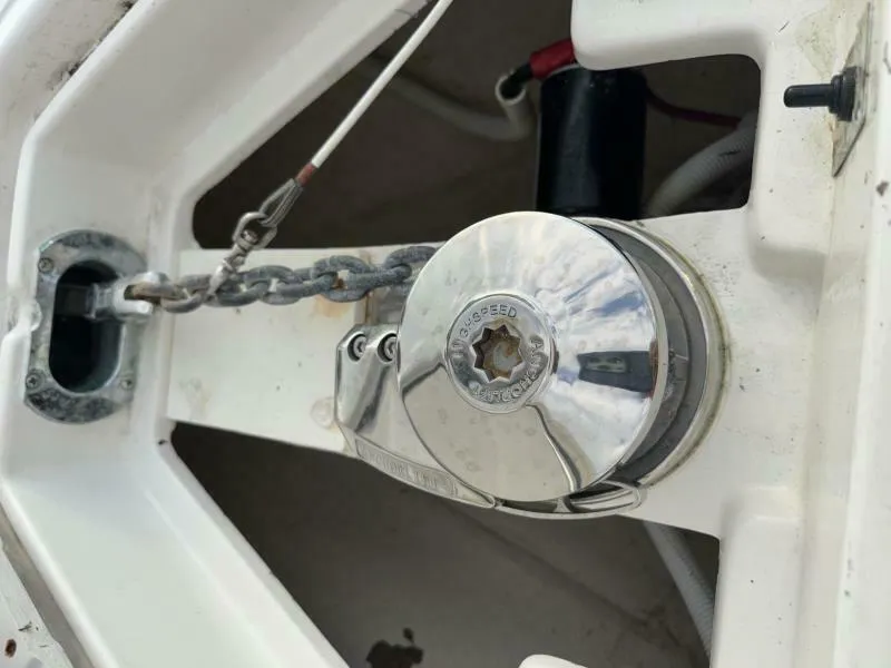 Slide: The Image of Anchor chain and winch on a 2008 Jupiter 31 FS Center Console boat. - 16