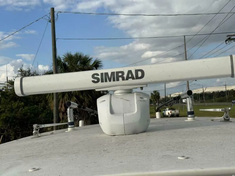 Slide: The Image of Simrad radar on 2008 Jupiter 31 FS Center Console boat, outdoor setting. - 18