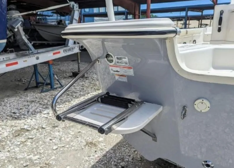 Slide: The Image of 2022 Carolina Skiff 23 LS boat with a foldable swim ladder on the stern. - 6