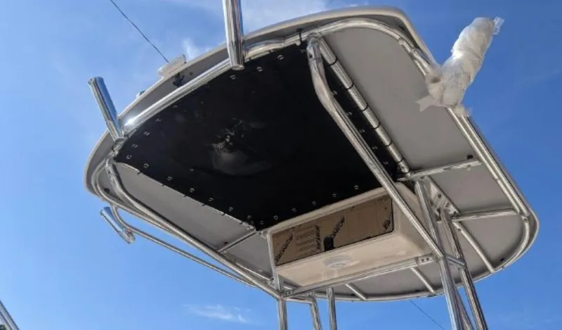 Slide: The Image of T-top of 2022 Carolina Skiff 23 LS boat against blue sky. - 9