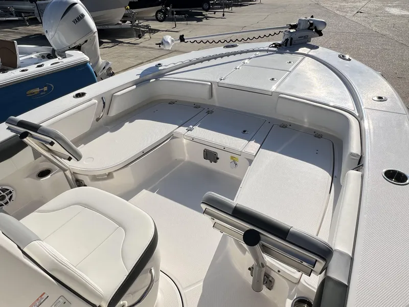 Slide: The Image of 2024 Robalo 246 Cayman boat interior with seating and storage compartments. - 8