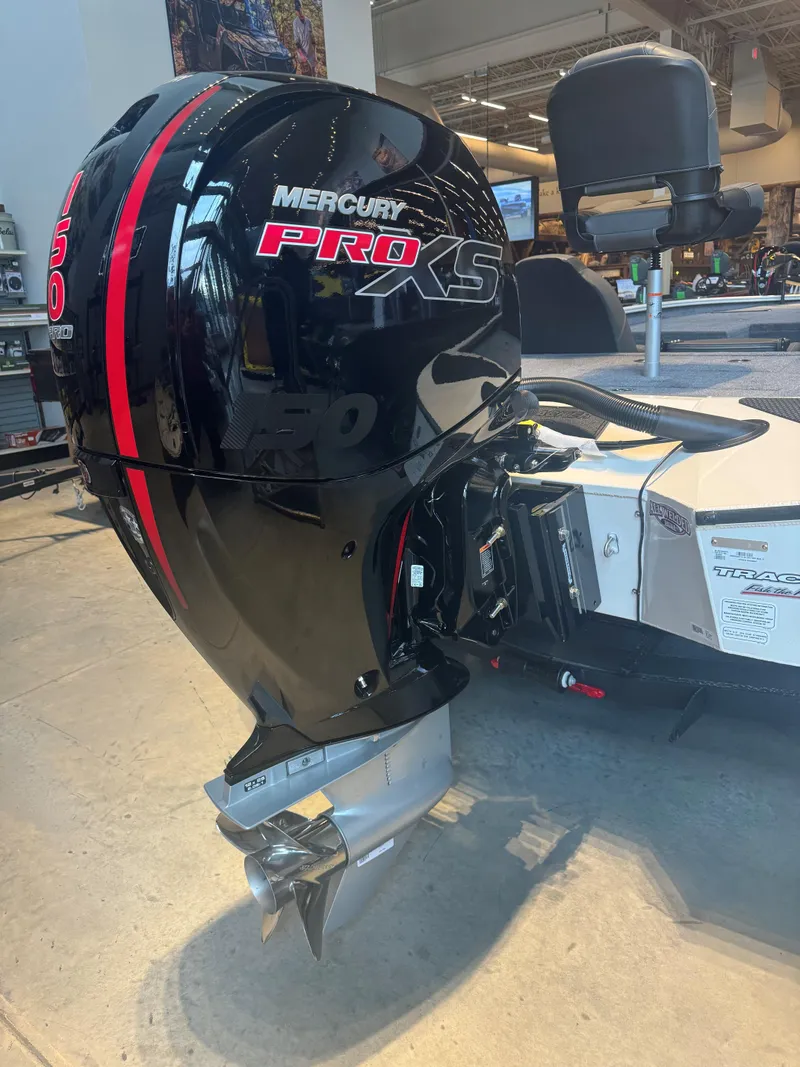 Slide: The Image of 2025 Tracker Savage 215 with Mercury Pro XS outboard motor in showroom. - 3