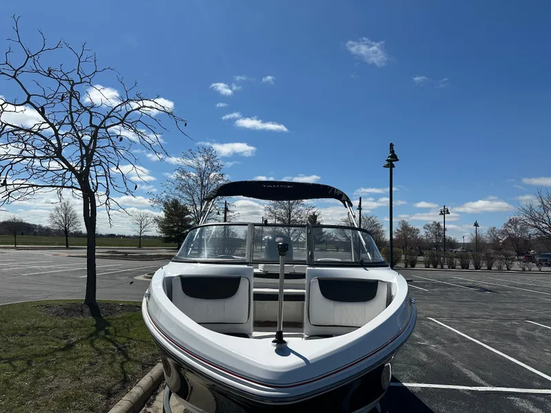 Slide: The Image of 2024 Tahoe 185 S boat parked under a clear blue sky. - 2
