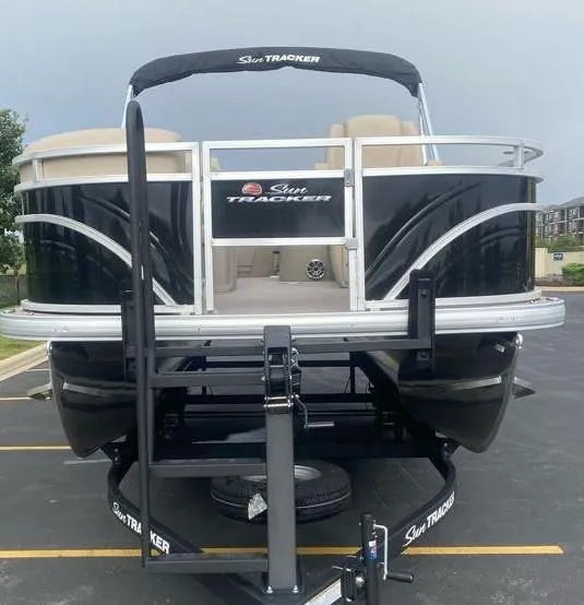 Slide: The Image of 2024 Sun Tracker SportFish 20 DLX pontoon boat on trailer, front view. - 4