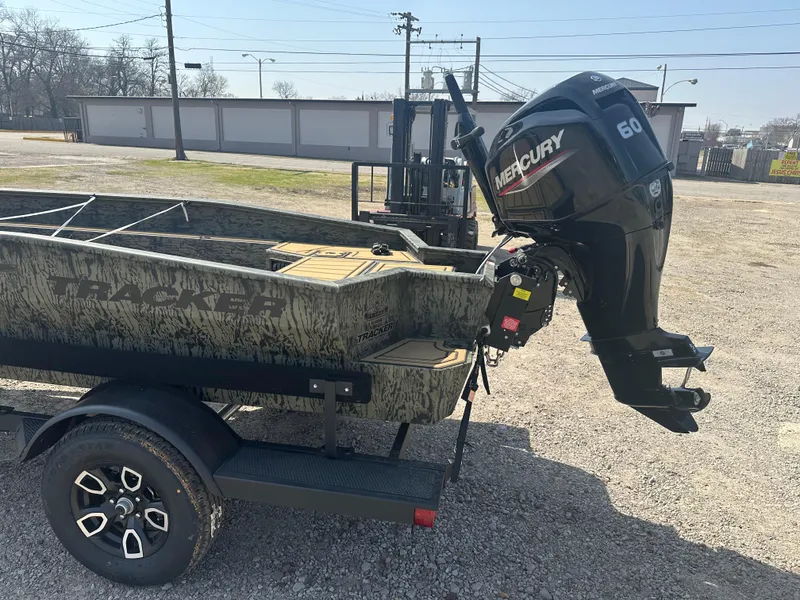 Slide: The Image of 2025 Tracker Grizzly 1650 T Prairie Wings Edition boat with Mercury 60 engine on trailer. - 3