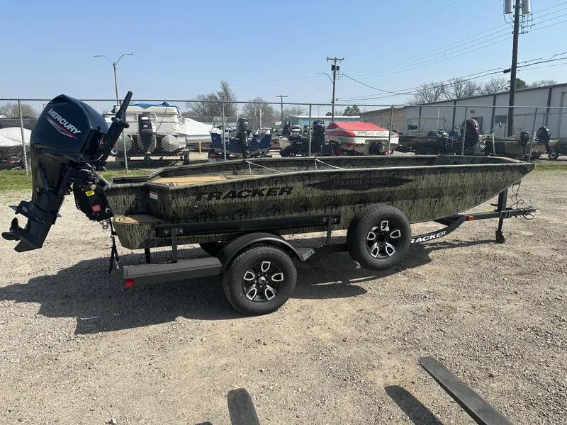 Slide: The Image of 2025 Tracker Grizzly 1650 T Prairie Wings Edition boat on trailer, outdoors. - 5