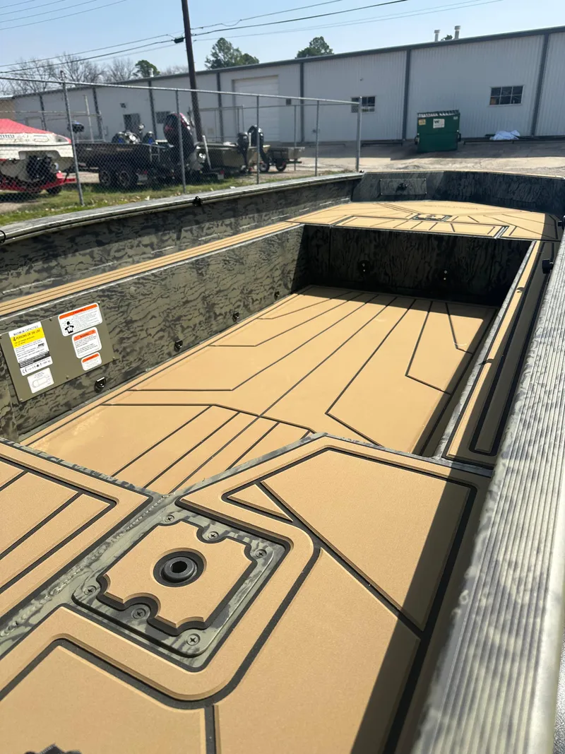 Slide: The Image of 2025 Tracker Grizzly 1650 T Prairie Wings Edition boat interior, featuring a spacious, durable design. - 7