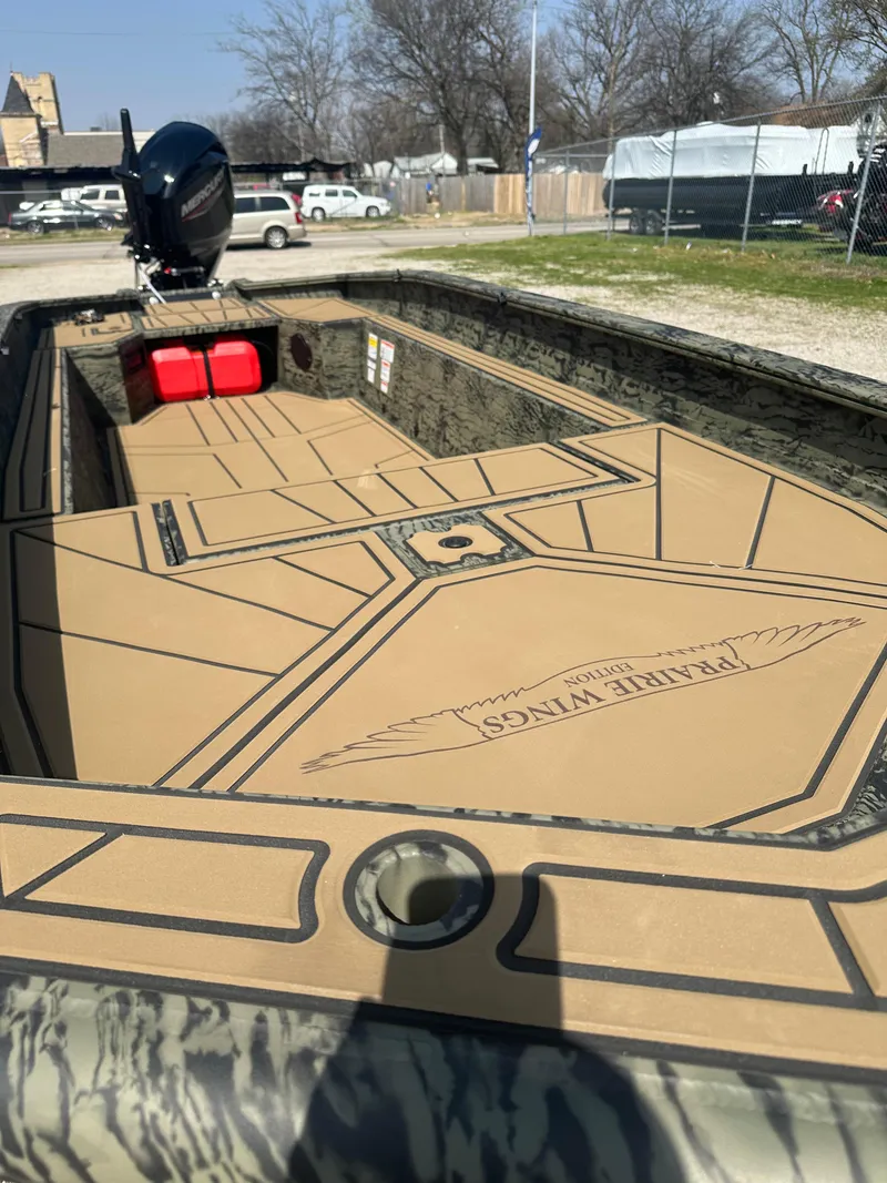 Slide: The Image of 2025 Tracker Grizzly 1650 T Prairie Wings Edition boat with camo design and spacious deck. - 8