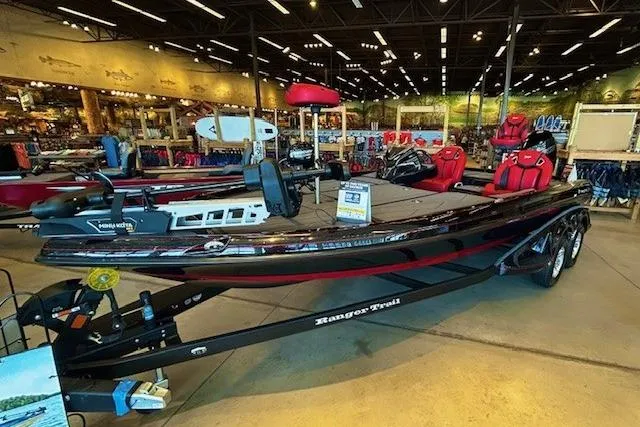 The Image of 2025 Ranger Z520R boat displayed in a showroom with red seating and modern design. - 0