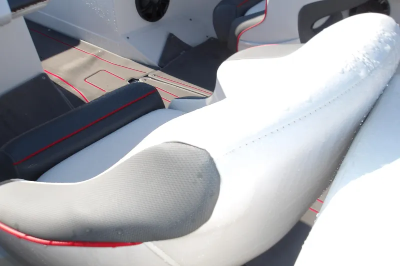 Slide: The Image of Interior of 2025 Tahoe 210 S boat with modern seating and red accents. - 10