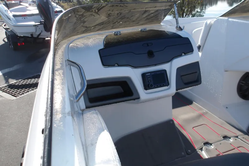 Slide: The Image of 2025 Tahoe 210 S boat dashboard with modern controls and sleek design. - 11