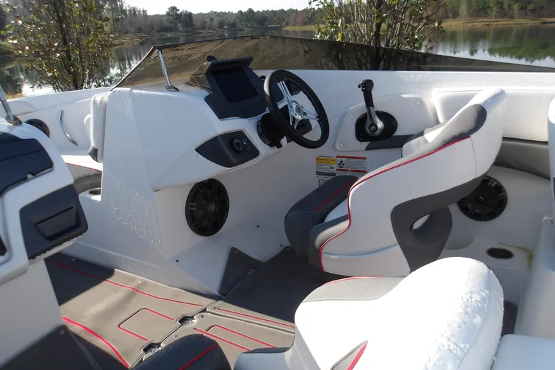 Slide: The Image of 2025 Tahoe 210 S boat interior with modern dashboard and comfortable seating. - 8