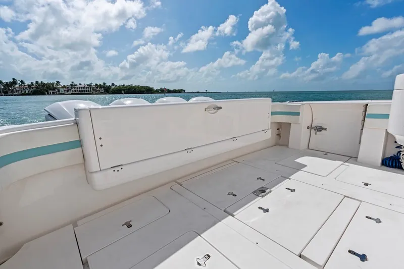 Slide: The Image of 2018 Intrepid 475 Sport Yacht deck with ocean view and clear skies. - 23
