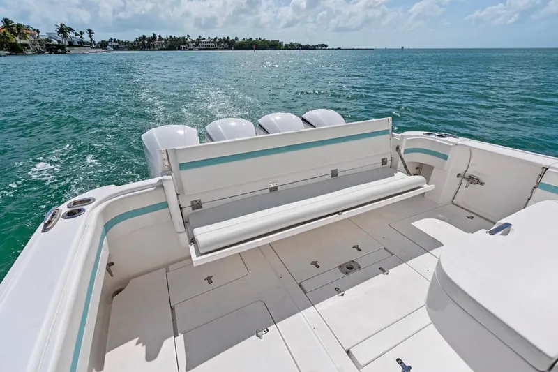 Slide: The Image of 2018 Intrepid 475 Sport Yacht deck with ocean view and seating. - 25