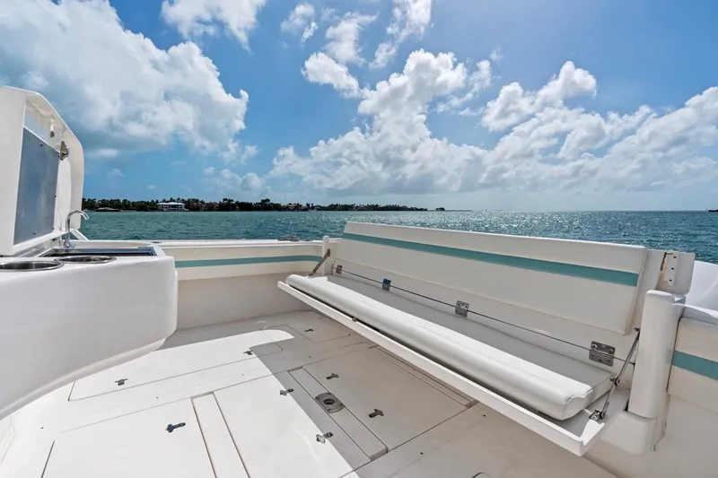 Slide: The Image of 2018 Intrepid 475 Sport Yacht deck with ocean view under blue sky. - 28
