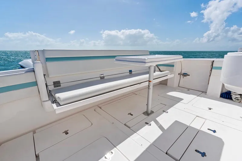 Slide: The Image of 2018 Intrepid 475 Sport Yacht deck with seating and ocean view. - 29