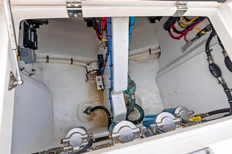 Slide: The Image of Engine compartment of 2018 Intrepid 475 Sport Yacht, showcasing wiring and mechanical components. - 36