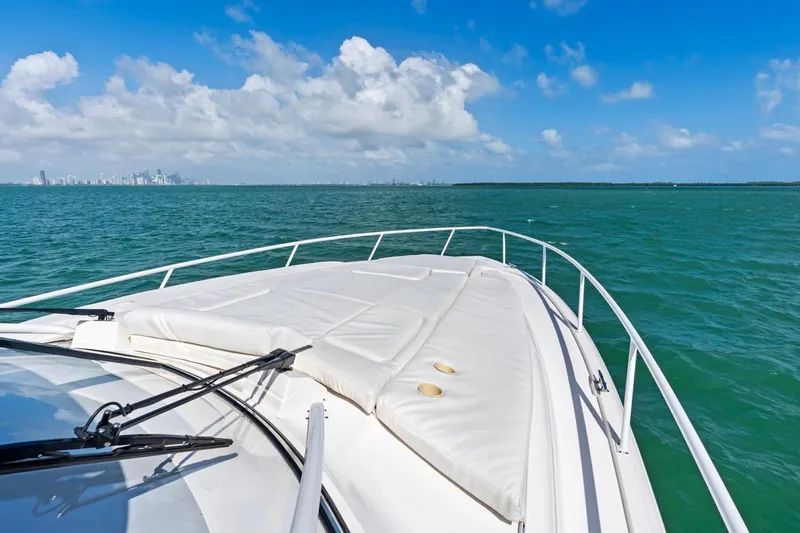 Slide: The Image of 2018 Intrepid 475 Sport Yacht cruising on turquoise waters under a clear blue sky. - 39