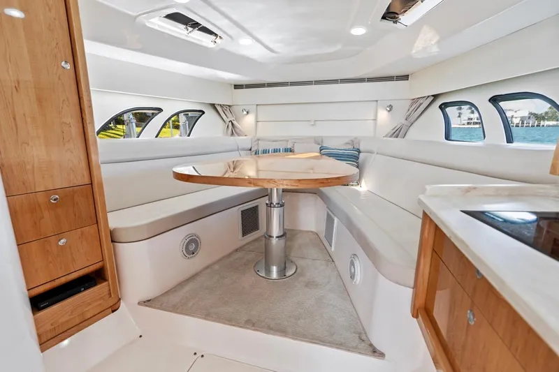 Slide: The Image of Luxurious interior of 2018 Intrepid 475 Sport Yacht with elegant seating and wooden accents. - 43