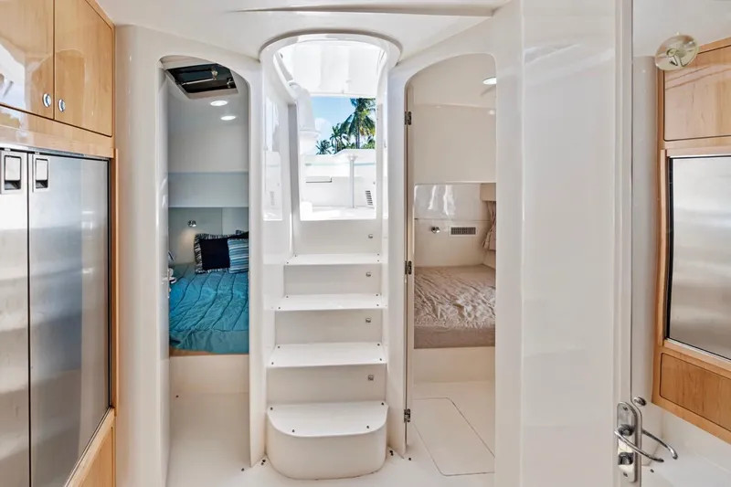 Slide: The Image of Interior of 2018 Intrepid 475 Sport Yacht, featuring modern design and comfortable sleeping quarters. - 49