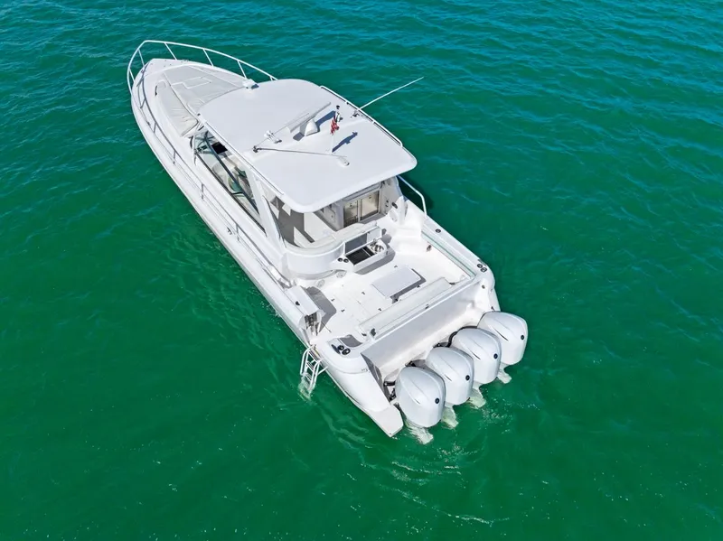 Slide: The Image of 2018 Intrepid 475 Sport Yacht on clear turquoise water, aerial view. - 8