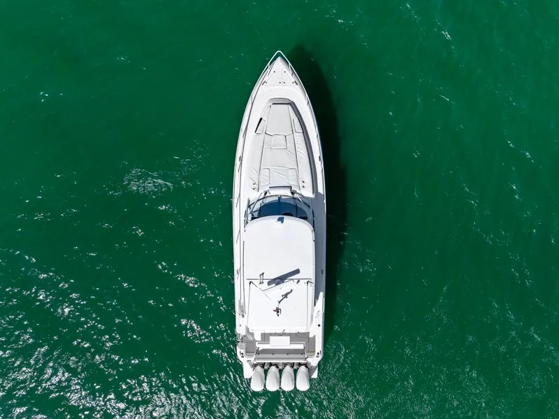 Slide: The Image of Aerial view of 2018 Intrepid 475 Sport Yacht on green water. - 9