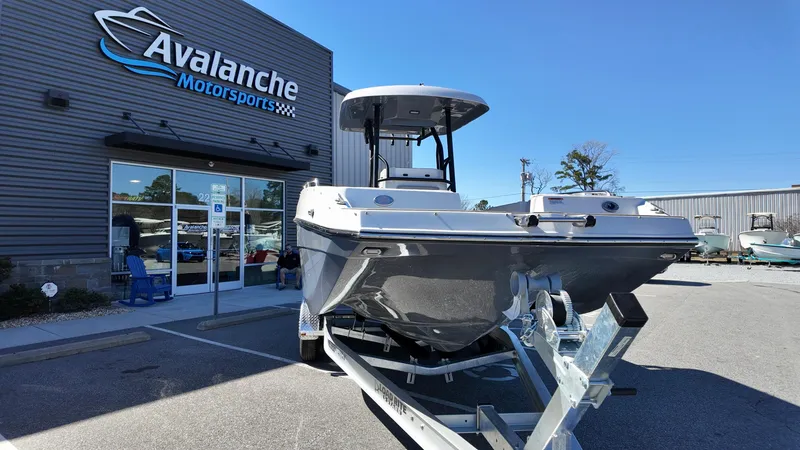 Slide: The Image of 2025 Starcraft SVX 231 OB CC boat displayed at Avalanche Motorsports dealership. - 3