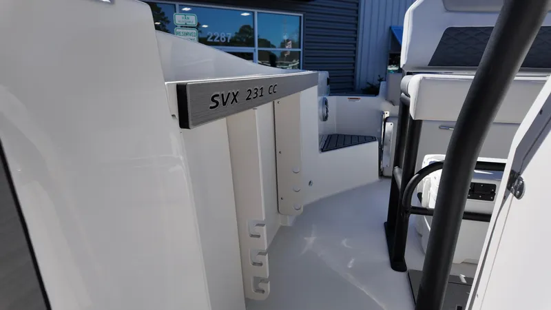 Slide: The Image of 2025 Starcraft SVX 231 OB CC boat interior, showcasing sleek design and modern features. - 7